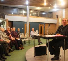 Mgr. Guy Harigny, bisschop van Doornik en referent voor de relaties met de islam tijdens een lezing in precoronatijden © RR