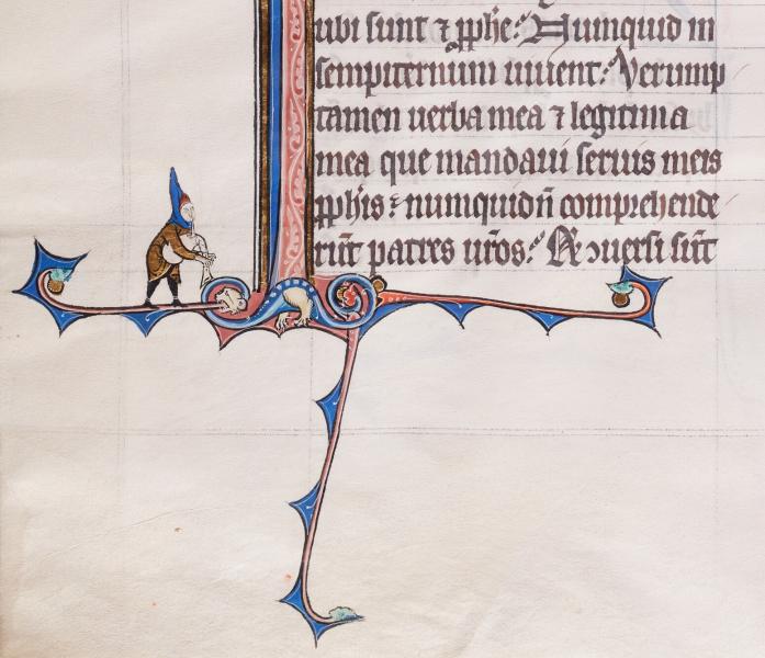 Een middeleeuwse man bespeelt een doedelzak in de marge. Archief Grootseminarie Brugge, Ms. 5/191, fol. 222v.  © stad Brugge