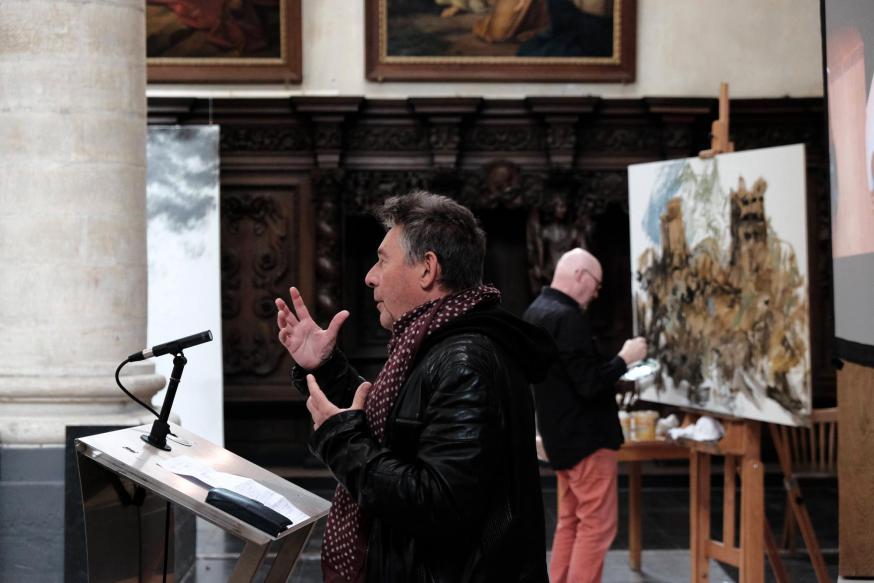 Rudi Vranckx, en het schilderij geeft inhoud weer van zijn pleidooi © Pastorale zone Leuven aan de Dijle