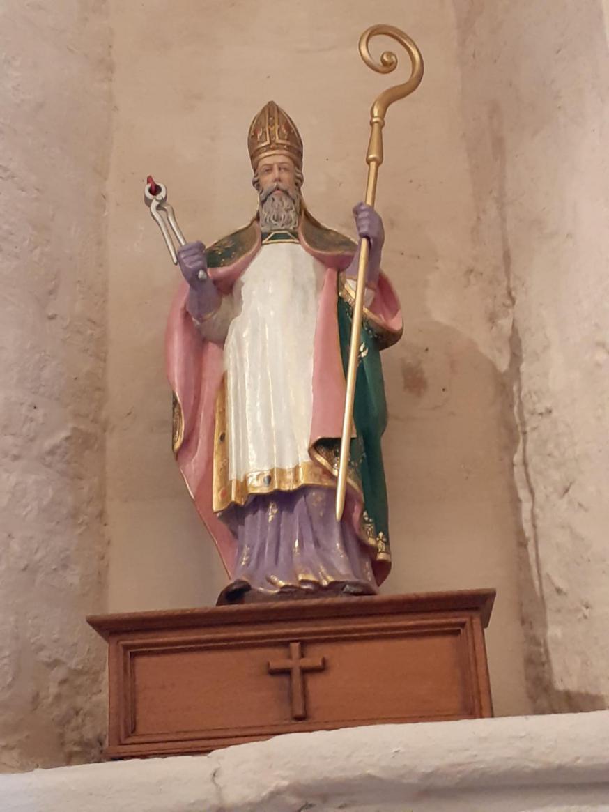 Het beeld dateert van de 19de eeuw en is vervaardigd door Jean-Baptiste Van Biesbroeck, bestemd voor de nis in de Sint-Livinuscrypte. Het is een neogotisch gepolychromeerd beeld historisch verbonden aan het kerkgebouw en sinds 1845 aanwezig in de kerk.  D © Agnes De Clerq