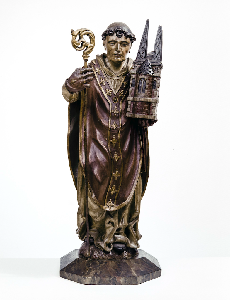 Houten beeld van Sint-Trudo uit de eerste helft van de 17de eeuw. © BaLat, KIK, Jean-Luc Elias Houten beeld van Sint-Trudo uit de eerste helft van de 17de eeuw. © BaLat, KIK, Jean-Luc Elias